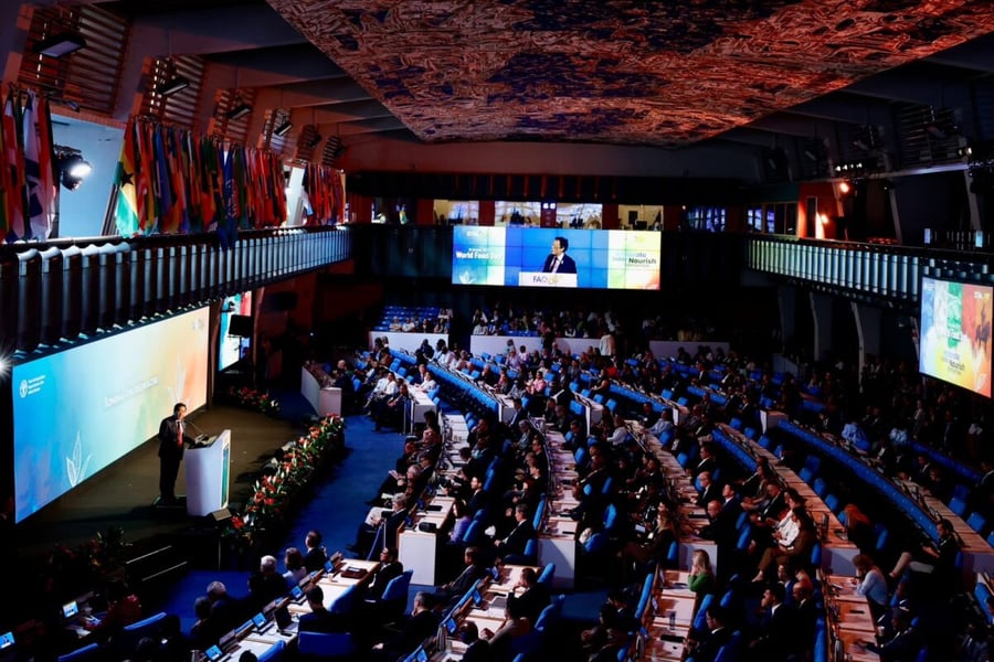 FAO Director-General Qu Dongyu speaks from a podium in the plenary hall at FAO headquarters in Rome during World Food Day 2026