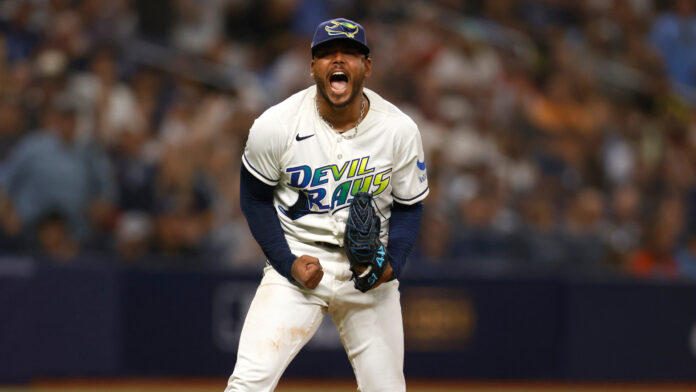Rays pitcher Freddy Peralta shouts and clenches his fist during Game 2 of the ALCS at Tropicana Field