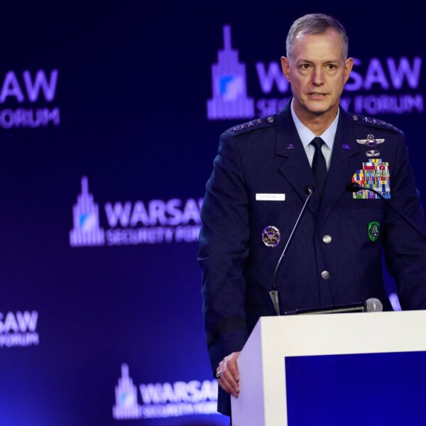 US Gen. Alexus Grynkewich speaking at a podium in front of Warsaw Security Forum banners