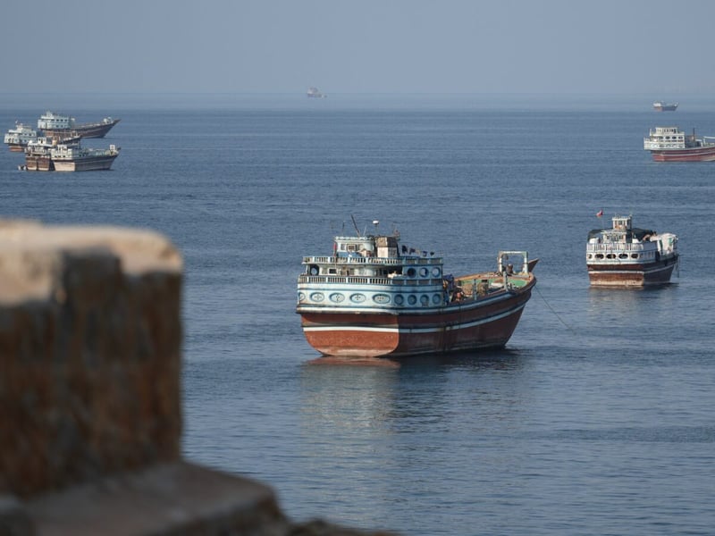 Cargo ships anchored off the coast of Khasab in Oman's Musandam governorate, near the Strait of Hormuz, on October 2, 2026