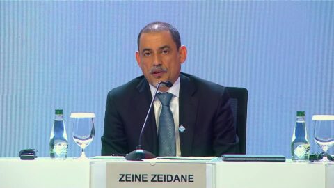 Zeine Zeidane, director of the IMF African Department, speaking at a microphone behind a name card at the October 2026 Annual Meetings briefing in Bangkok