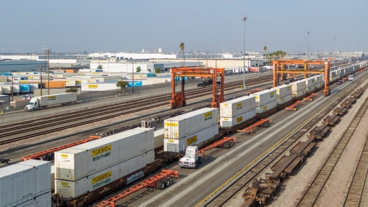 J.B. Hunt Intermodal containers stacked on rail cars at a rail depot
