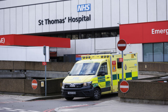 A London Ambulance Service emergency ambulance leaves the emergency entrance of St Thomas' Hospital in London