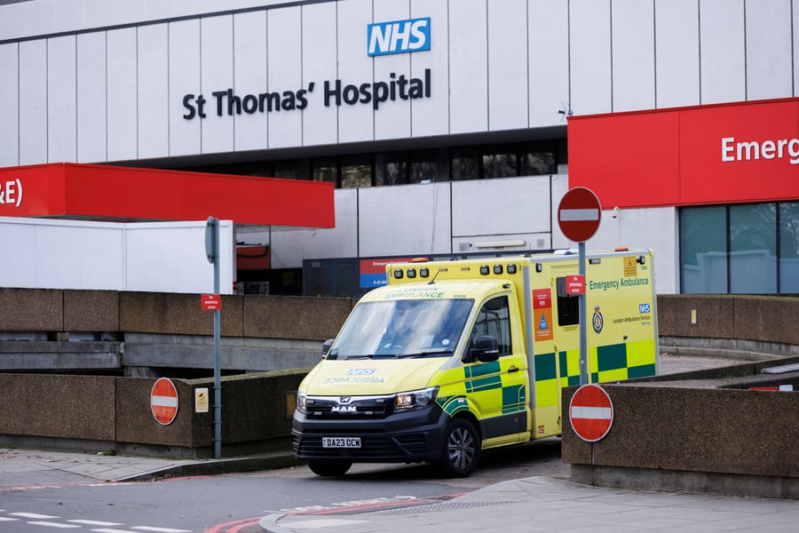 A London Ambulance Service emergency ambulance leaves the emergency entrance of St Thomas' Hospital in London