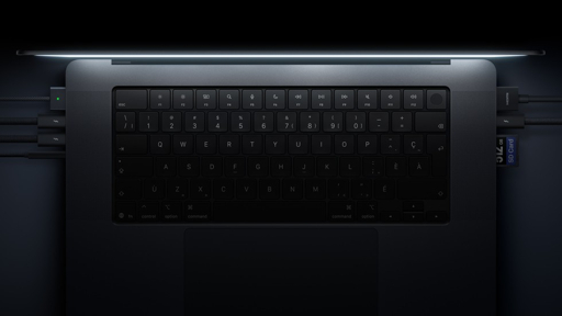 Close-up of MacBook Pro keyboard, trackpad and ports in official Apple promotional imagery