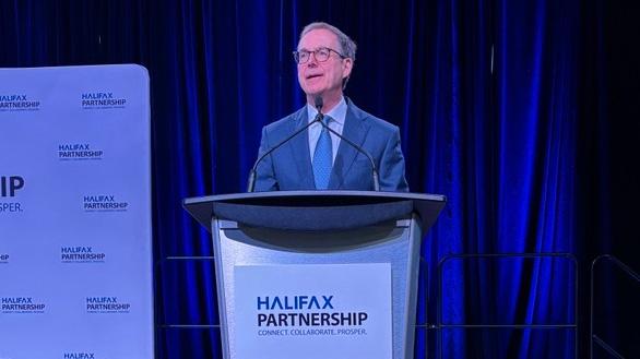 Bank of Canada Governor Tiff Macklem speaking at a podium marked Halifax Partnership