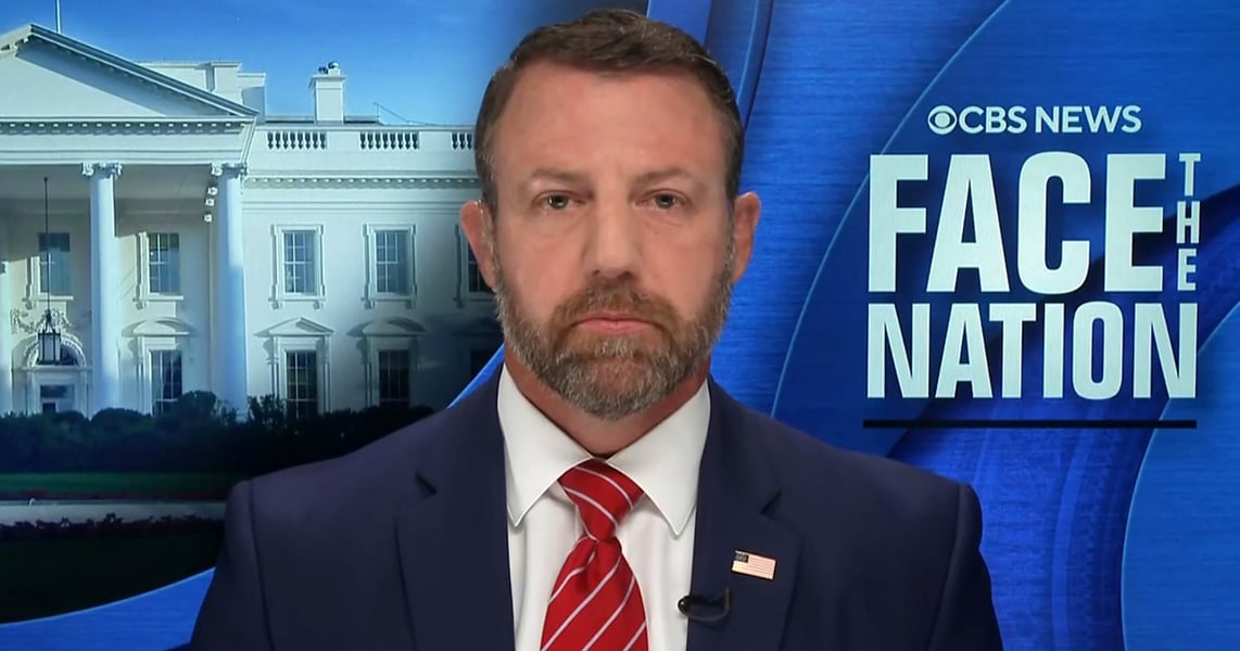Homeland Security Secretary Markwayne Mullin on the Face the Nation set with the White House behind him