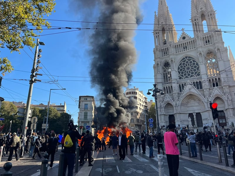 Archive photograph of bins burning in a Marseille street on October 17
