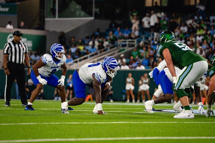 Memphis defensive linemen set at the line of scrimmage opposite a Tulane offensive lineman at Yulman Stadium