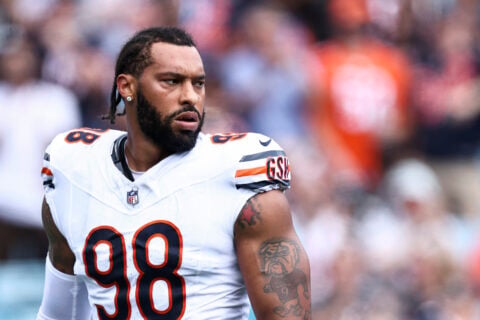 Chicago Bears defensive end Montez Sweat in a white number 98 jersey looks to his left during a game
