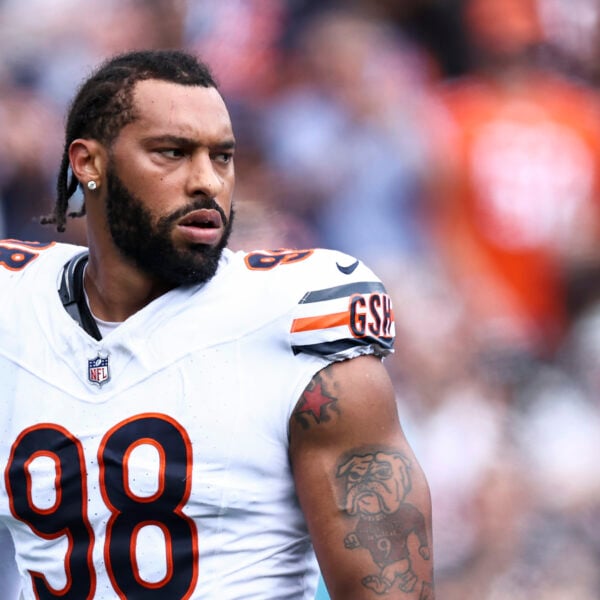 Chicago Bears defensive end Montez Sweat in a white number 98 jersey looks to his left during a game