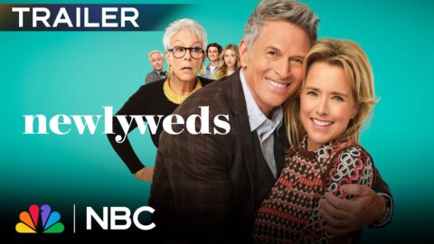 Tim Daly and Téa Leoni embrace in front of a teal background in NBC promotional art for the sitcom Newlyweds, with supporting cast behind them