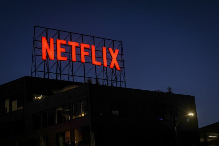 A Netflix sign on the roof of an office building