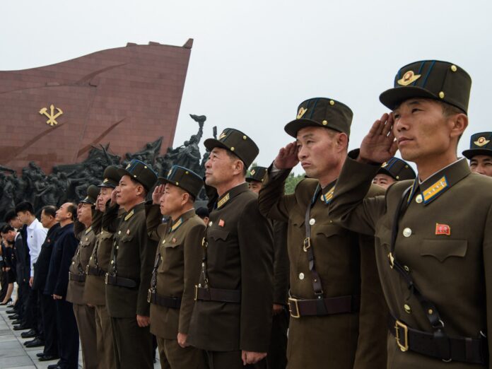 Korean People's Army personnel salute statues of Kim Il Sung and Kim Jong Il on Mansu Hill in Pyongyang as North Korea fires ballistic missiles