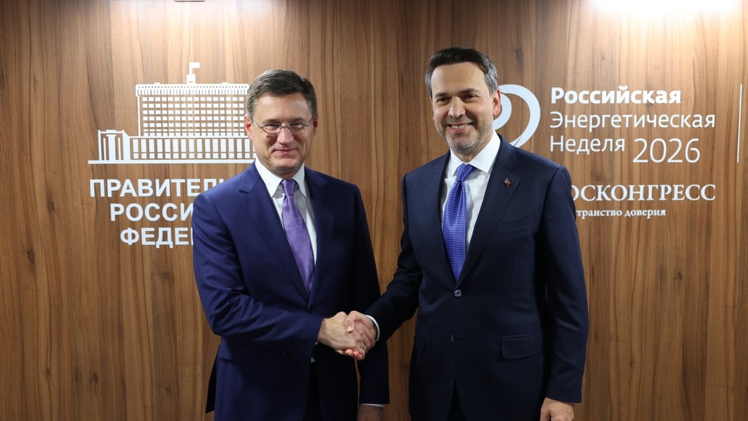 Russian Deputy Prime Minister Alexander Novak and Turkish Energy Minister Alparslan Bayraktar shaking hands in front of a Russian Energy Week 2026 backdrop
