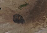 Satellite image of eastern Mongolia showing a large dark burn scar on brown steppe after the Numrug reserve fire