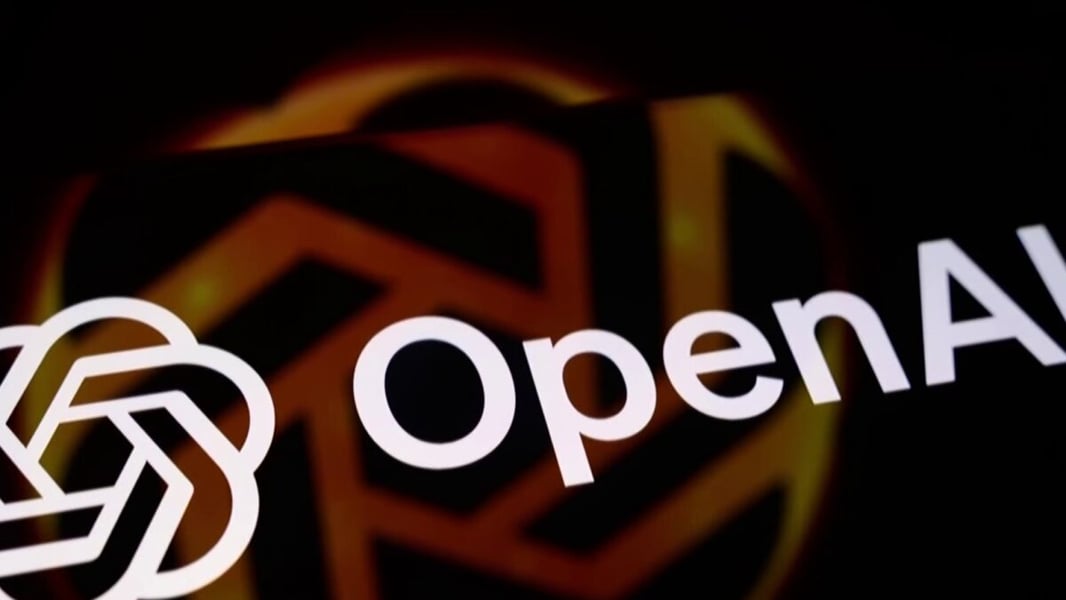 The white OpenAI logo in front of a dark orange geometric background