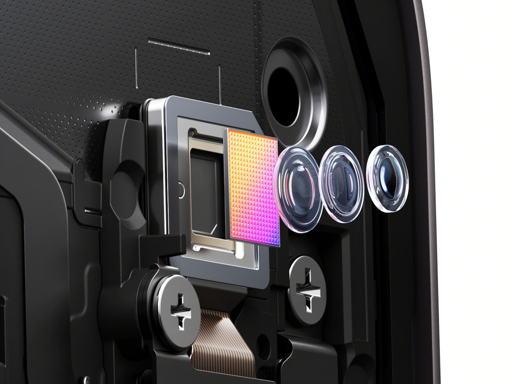 Close-up illustration of a smartphone camera module with lenses and a colour-filter image sensor.