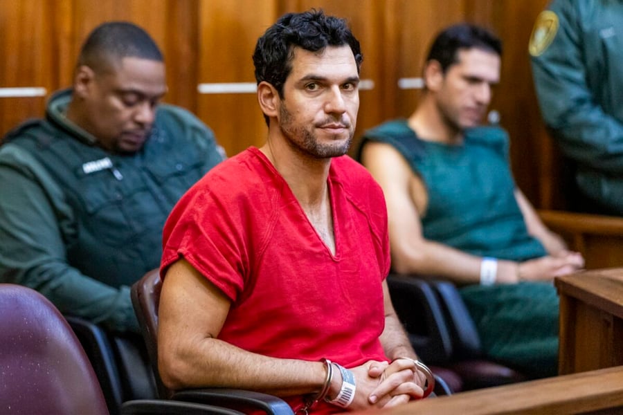 Oren Alexander in a red jail uniform and handcuffs at his bond hearing in a Miami courtroom in December 2024