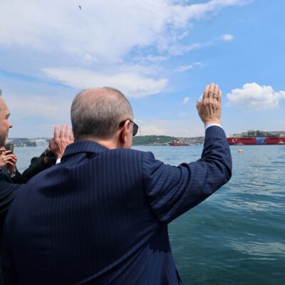 President Erdogan waves at the Osman Gazi floating gas platform as it passes through the Istanbul Strait