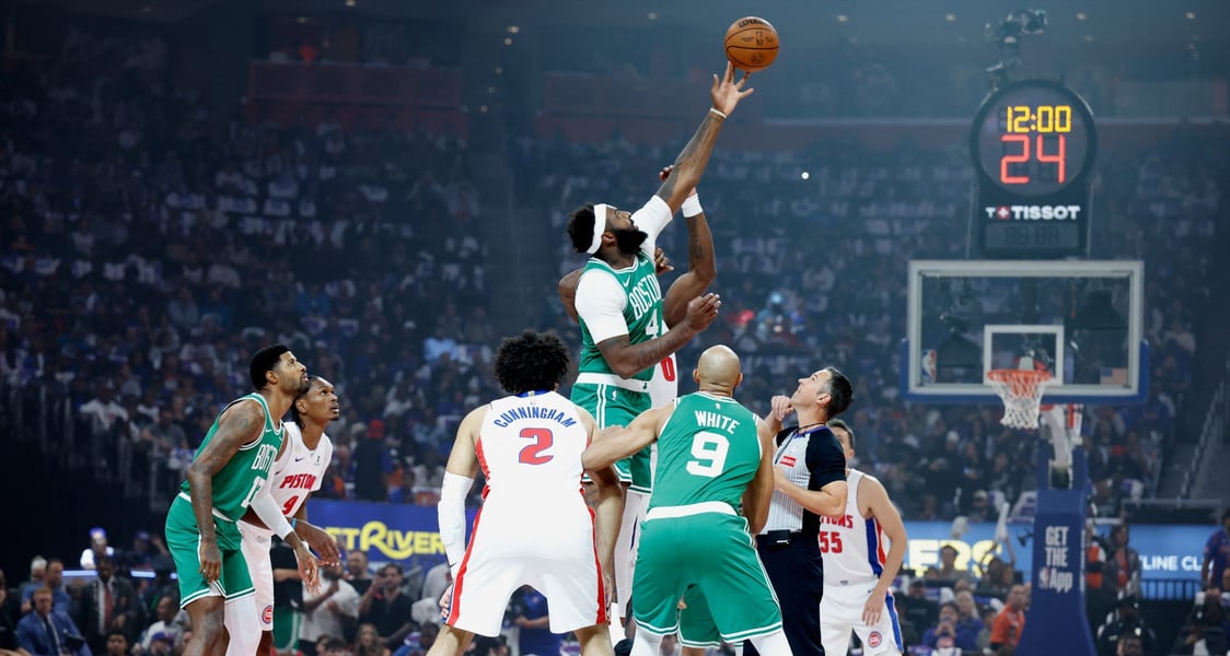 Boston Celtics and Detroit Pistons players during the NBA season opener at Little Caesars Arena on October 20, 2026.