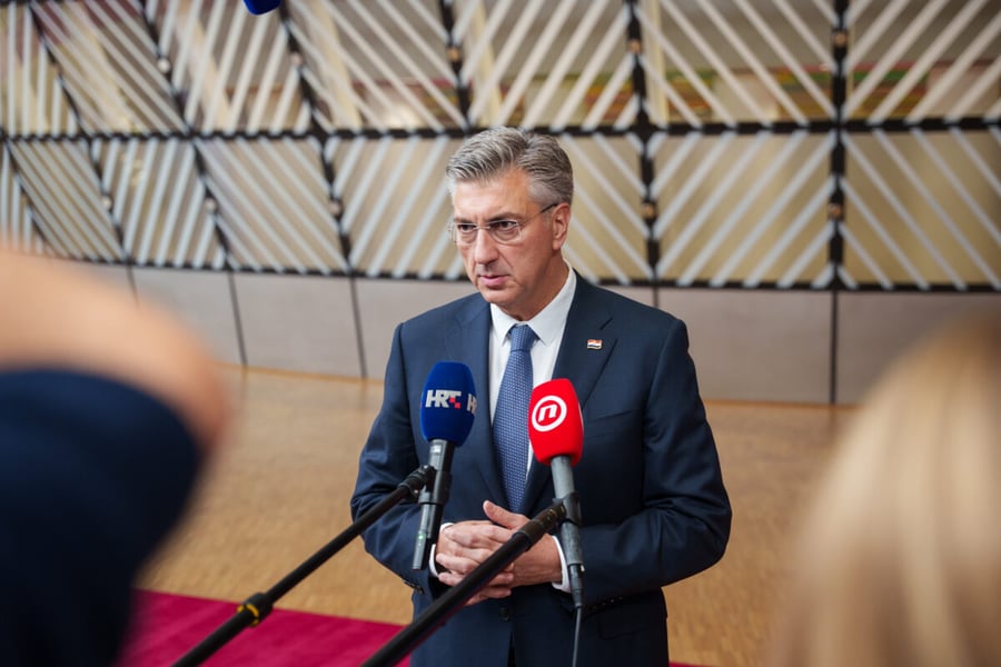 Croatian Prime Minister Andrej Plenkovic speaks into microphones before the European Council summit in Brussels