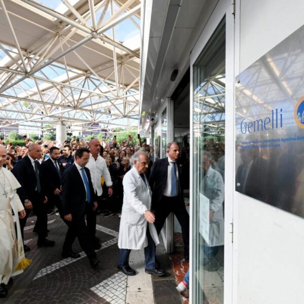 Pope Leo XIV waves as he walks into Gemelli Hospital in Rome
