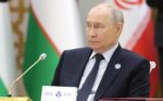 Vladimir Putin seated at the CIS heads of state meeting in Turkmenistan on October 9, 2026