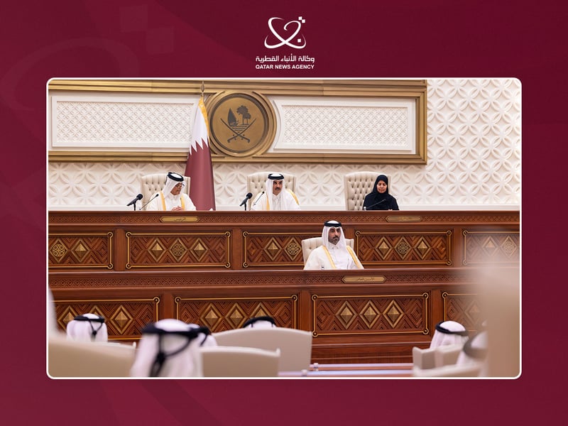 The Shura Council dais in Doha with the national flag and emblem, and officials seated at the front