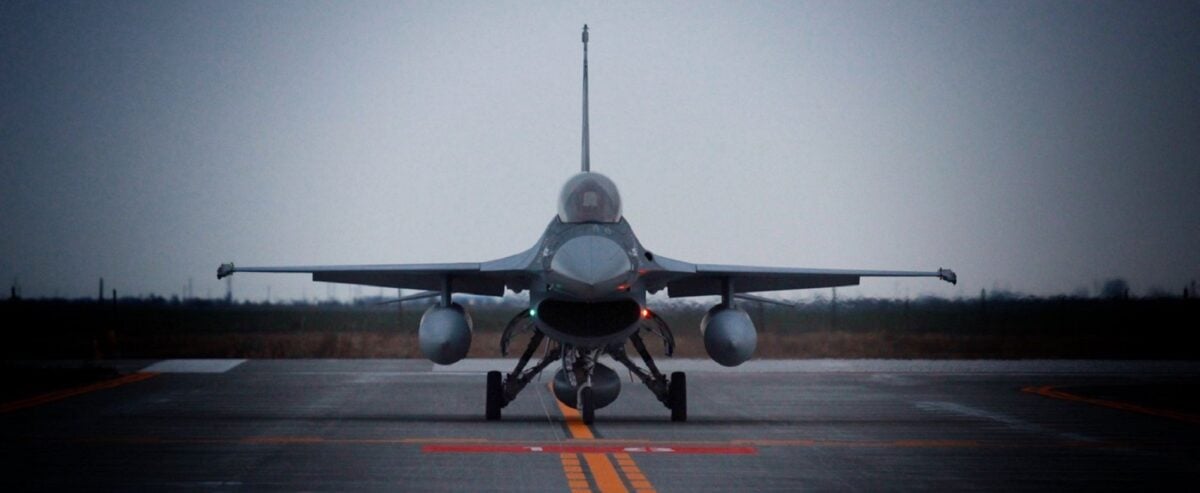 A fighter jet seen head-on on a taxiway