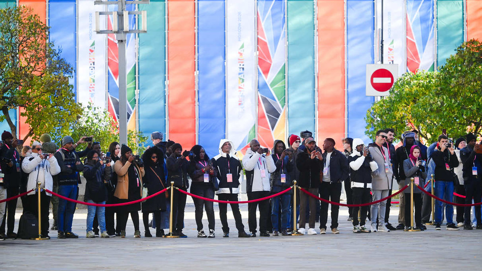 Participants in the Russia-Africa Media Forum walking through Moscow during a tour