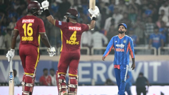 West Indies captain Shai Hope raising his bat as India captain Shreyas Iyer looks on in Ranchi