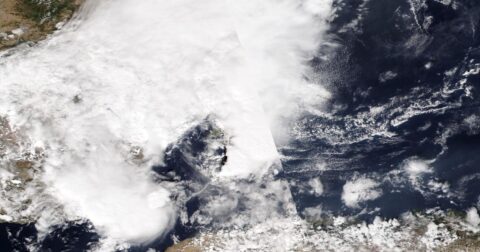Satellite image of thick white cloud covering eastern Spain and the sea off its coast, with clear sea to the east