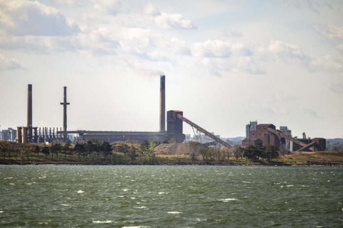 Stelco steel plant in Hamilton, Ontario, with smokestacks and conveyors seen across Hamilton Harbour