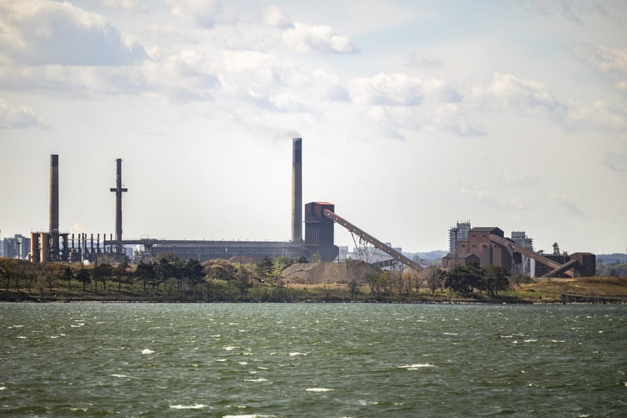 Stelco steel plant in Hamilton, Ontario, with smokestacks and conveyors seen across Hamilton Harbour