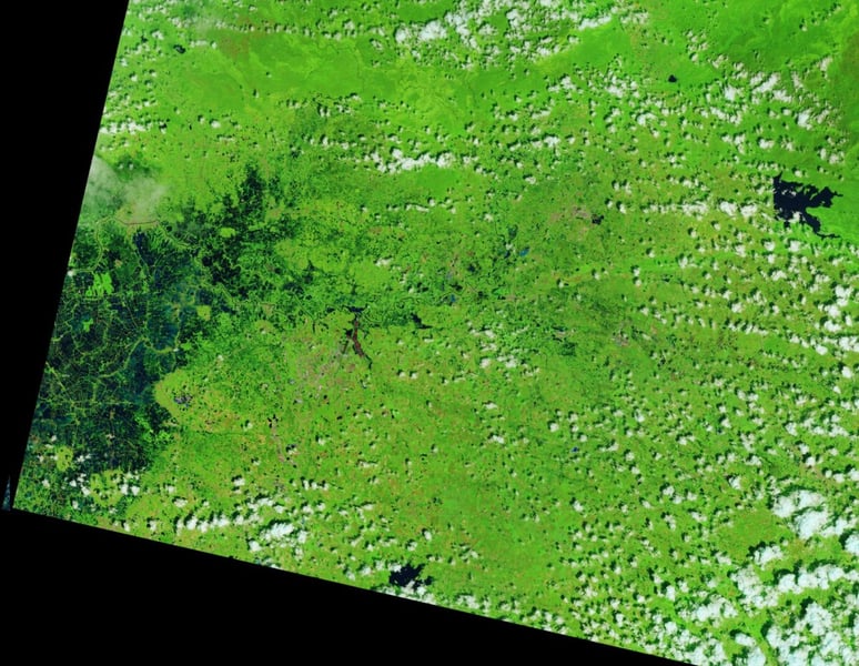 False-color Landsat image of an area of Thailand on October 7, 2025, with green vegetation and few flooded areas