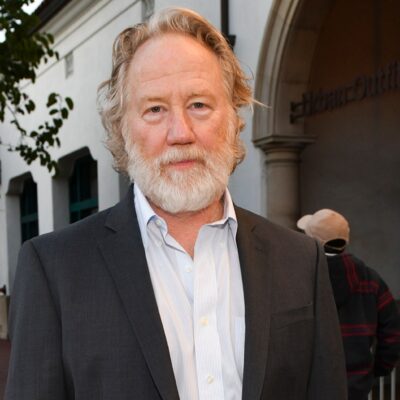 Actor and director Timothy Busfield, wearing a dark jacket, stands on a street in a file photo
