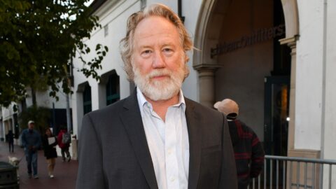 Actor and director Timothy Busfield, wearing a dark jacket, stands on a street in a file photo
