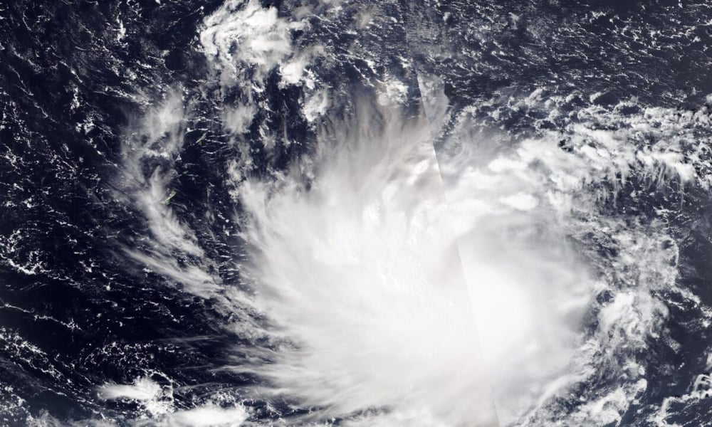 Satellite view of Tropical Storm Champi's cloud mass southeast of the green islands of the Marianas on Oct. 16