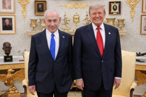 Benjamin Netanyahu and Donald Trump stand side by side in the Oval Office