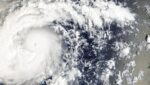 Satellite view of Typhoon Champi with a spiral cloud shield and a small eye, east-southeast of the Mariana Islands