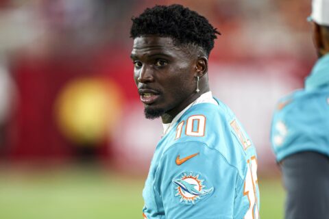 Tyreek Hill in a Miami Dolphins jersey looking toward the sideline