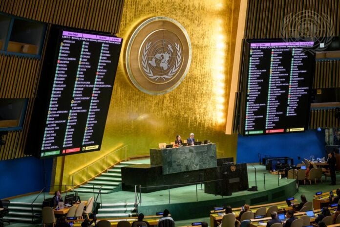 Voting boards in the UN General Assembly Hall showing 165 in favour, 7 against and 12 abstentions on the Cuba embargo resolution