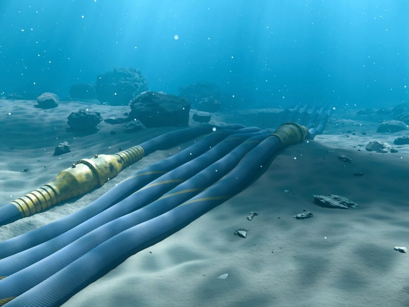 Illustration of submarine communications cables lying on a sandy seabed