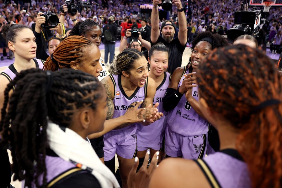 Golden State Valkyries players gather on the court after their Game 1 win over the Atlanta Dream in the WNBA Finals