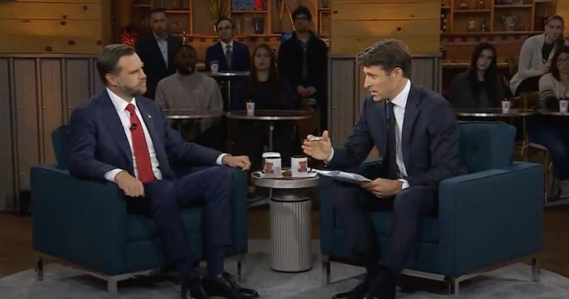 Vice President JD Vance, left, seated across from CBS Evening News anchor Tony Dokoupil in front of an audience at the CBS News town hall