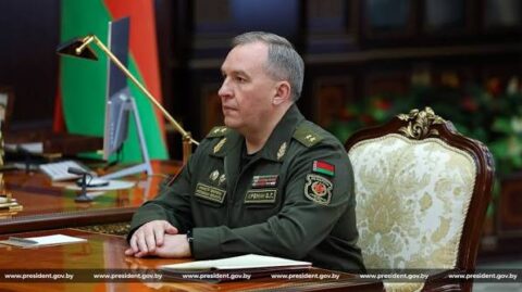 Belarusian Defense Minister Viktor Khrenin in uniform at a desk