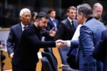 Ukrainian President Volodymyr Zelensky shakes hands with Belgian Prime Minister Bart De Wever at a European Council summit in Brussels