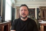 Ukrainian President Volodymyr Zelenskyy in a black shirt speaking from his office in Kyiv