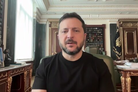 Ukrainian President Volodymyr Zelenskyy in a black shirt speaking from his office in Kyiv
